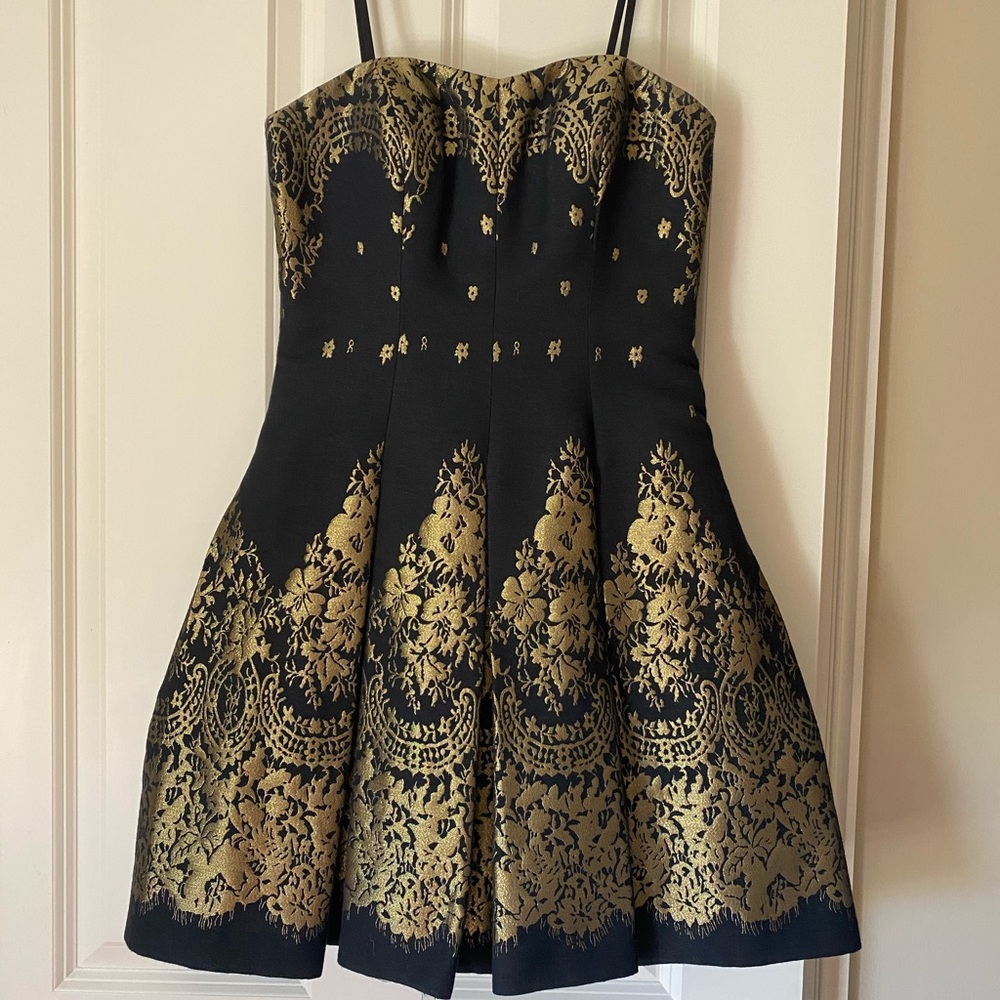 Black and gold mini dress